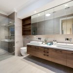 Bathroom with wooden countertop, toilet and shower