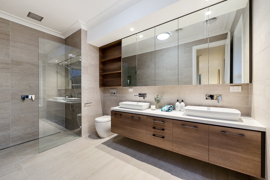 Bathroom with wooden countertop, toilet and shower