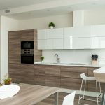 Kitchen with wooden cabinetry and dining table