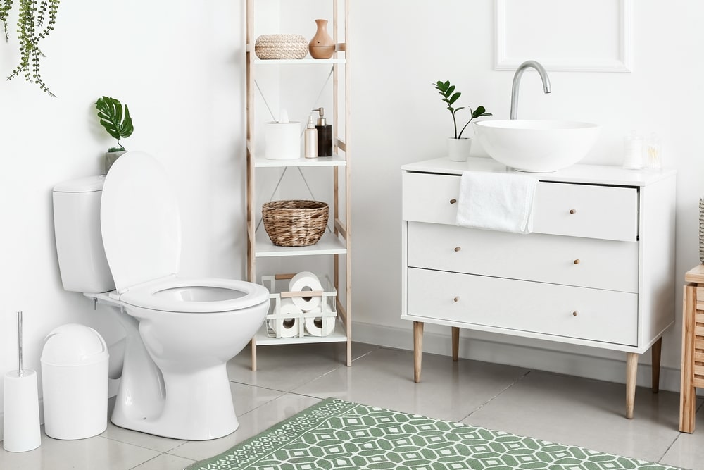 Bathroom with white desk and sink with toilet around