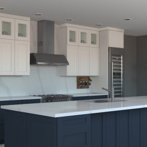 Kitchen with dark navy countertop and white cabinets
