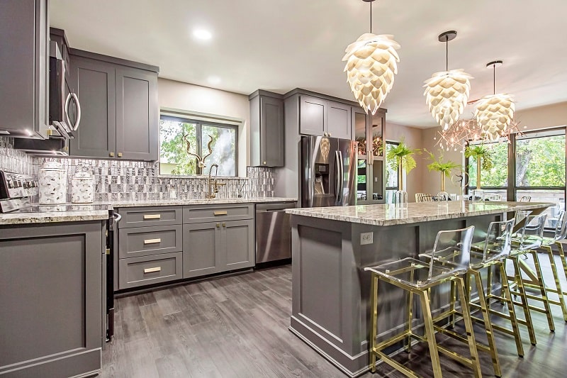 Modern Kitchen Beautiful Lights with countertop & chairs