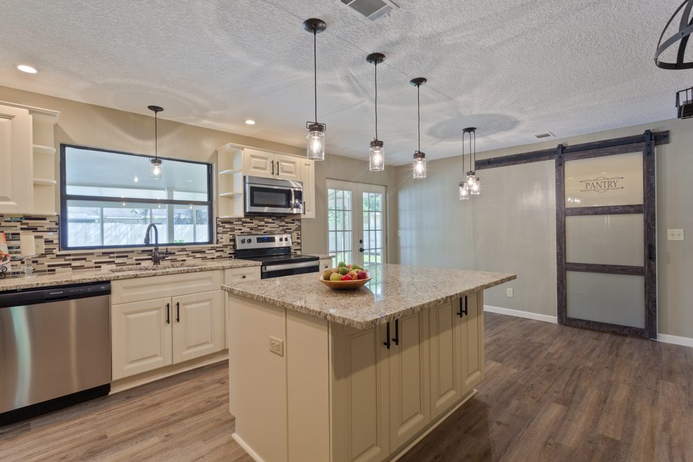 The Average Cost For A Kitchen Remodel in 2024 - Lighting Fixtures and Custom Cabinets