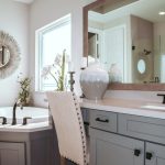 A creatively decorated small bathroom with budget-friendly accessories and storage solutions.