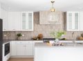 A modern kitchen featuring a budget-friendly peel-and-stick tile backsplash.