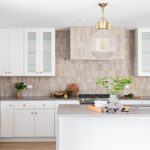 A modern kitchen featuring a budget-friendly peel-and-stick tile backsplash.