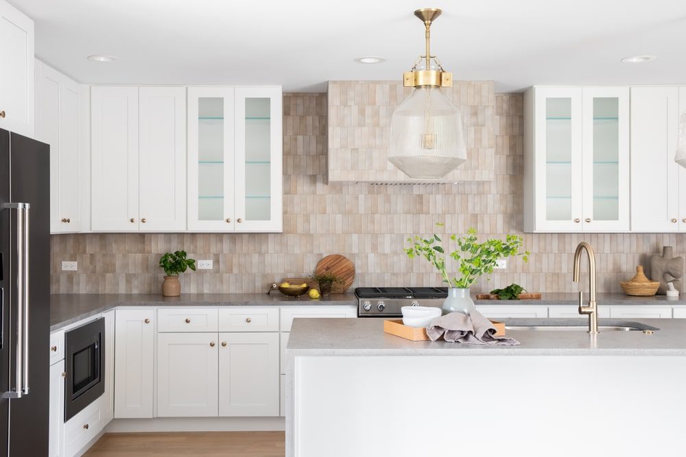 A modern kitchen featuring a budget-friendly peel-and-stick tile backsplash.