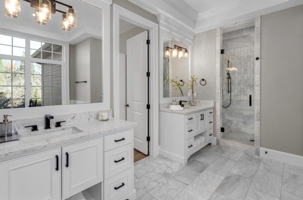 A beautifully remodeled bathroom featuring modern fixtures and a custom vanity.