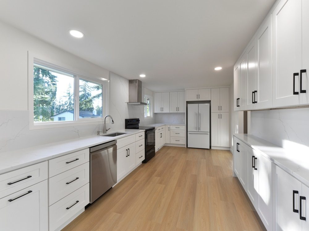 A modern kitchen with updated cabinets, countertops, and stainless-steel appliances.