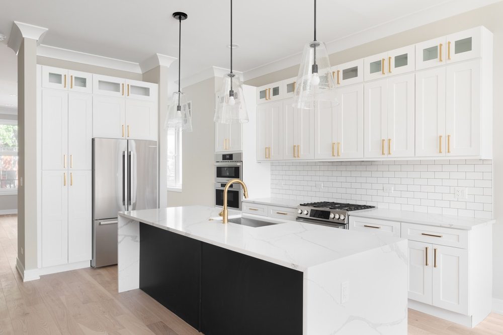 A modern kitchen with updated cabinets, countertops, and stainless-steel appliances.