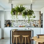 Modern kitchen island with wood and tile back panel design.