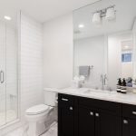 Small bathroom with walk-in shower and glass panels