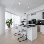 A budget-friendly kitchen remodel showing new paint, countertops, and updated fixtures in a cozy, modern kitchen