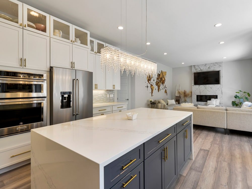 A budget-friendly kitchen remodel showing new paint, countertops, and updated fixtures in a cozy, modern kitchen