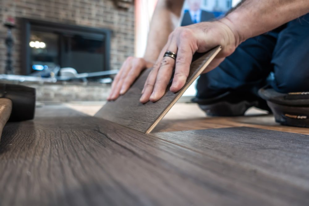 Installing vinyl plank flooring in a modern kitchen
