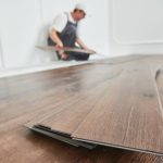 Installing vinyl plank flooring in a modern kitchen