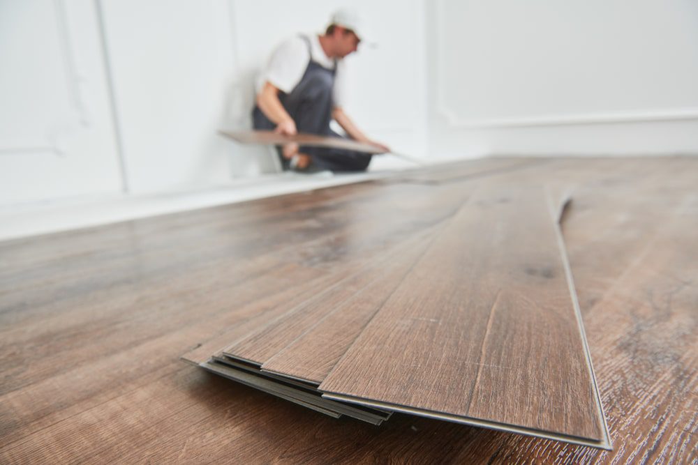 Installing vinyl plank flooring in a modern kitchen