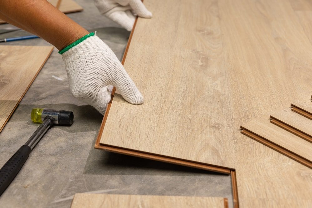 Installing vinyl plank flooring in a modern kitchen